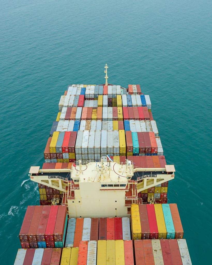 aerial-top-view-of-cargo-ship-carrying-container-for-import-export-goods-to-customer.jpg